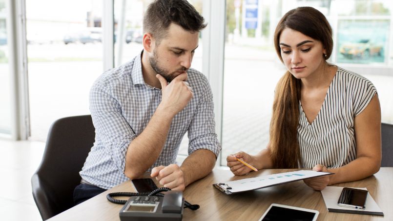 Couple reviewing budget together