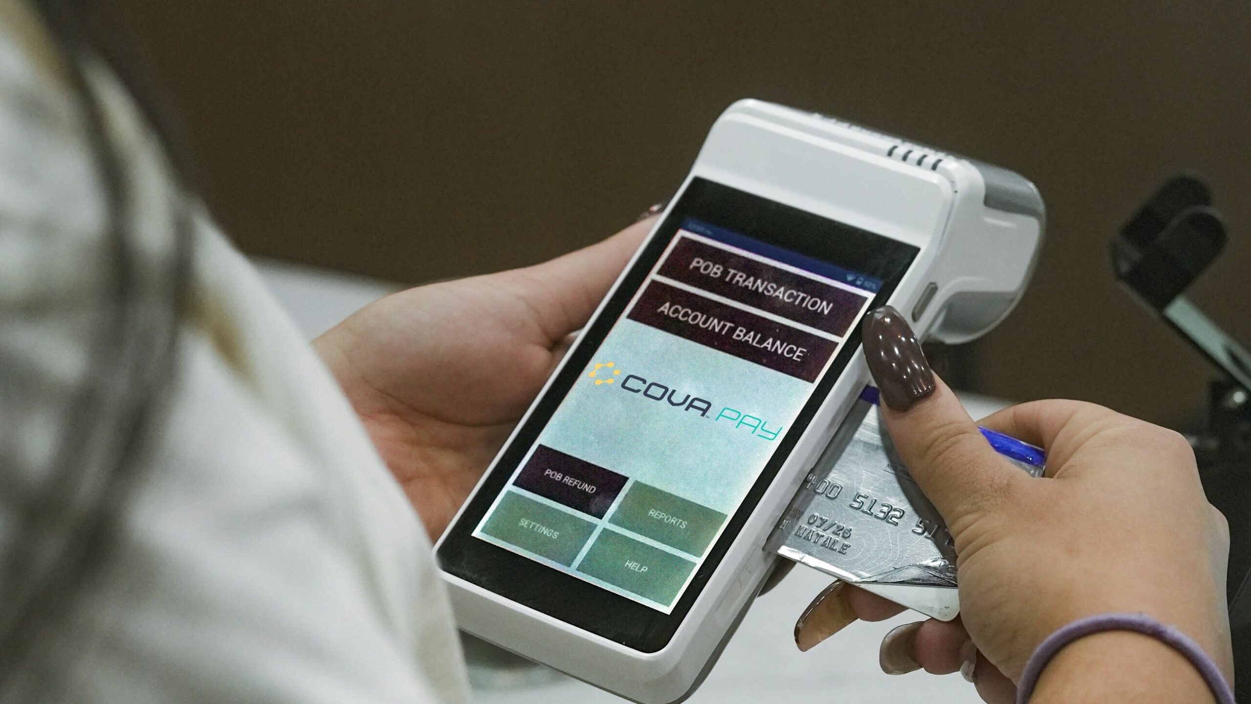 Person using a credit card on a payment terminal